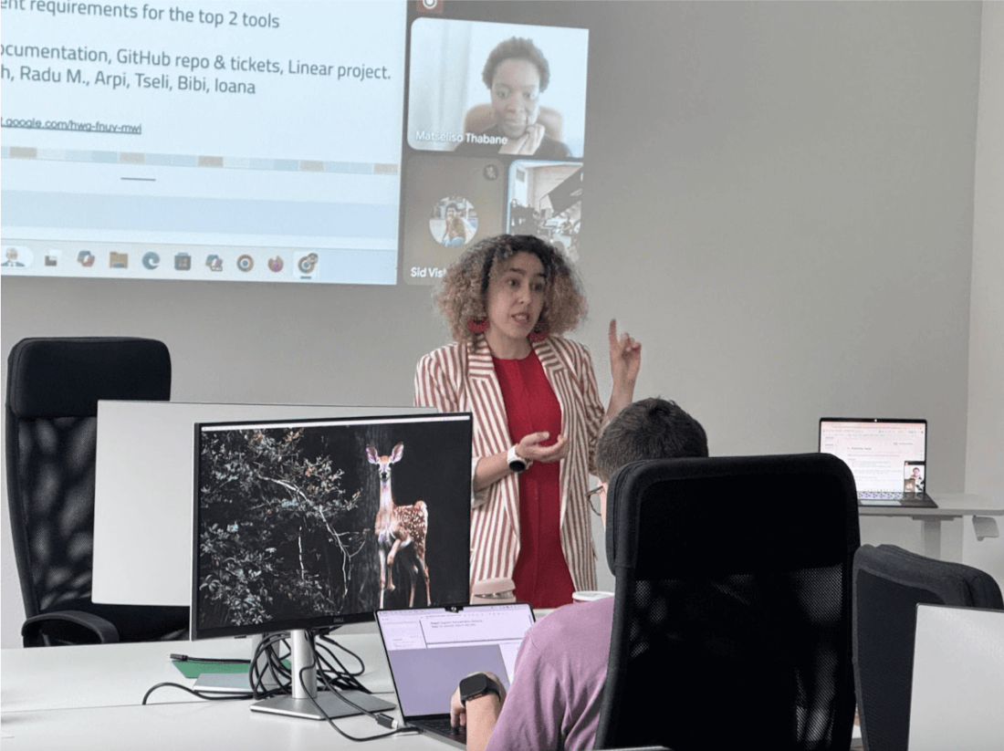 On site and online members of the Web Monetization team collaborating during a work session at the May 2025 work week.